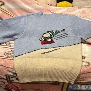 Blue and Beige Sweater with Cartoon Design
